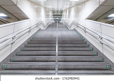 public staircase at station or mall for exit, entrance, emergency. stair inside the metro, subway with cleanly steel handrail. modern platform with granite staircase.   - Powered by Shutterstock