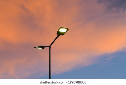 Public street lighting pole with LED lights with an amazing sunset color background. - Powered by Shutterstock