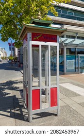 Public telephone booth on the street of Victoria BC, Canada-July 21,2021. Travel photo, street view, nobody, selective focus