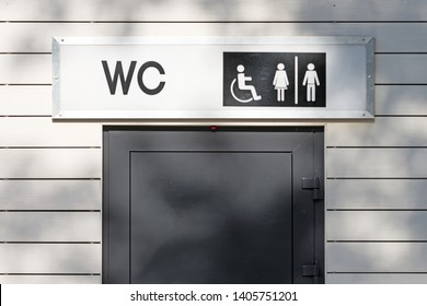 Public Toilet Entrance Front Close Up View Of Restroom Door With Wc Sign For Men Women Accessible Disabled Person In City Street Outdoor Bathroom Authentic Lifestyle Concept Natural Color Photo