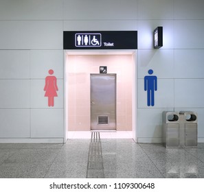 Public toilet entrance in modern airport building