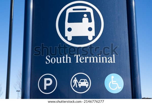 A public transit sign at a bus\
terminal for parking and car pooling in Airdrie Alberta\
Canada