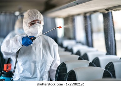 Public transport, bus disinfection, decontaminating due to coronavirus, covid19 contagion. Hygiene specialist in protective clothing sprays disinfectant liquid inside the vehicle. - Shutterstock ID 1725382126