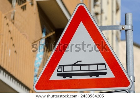 public transport tram, road signs, triangle, indicates medium passage such as light rail or tram, electrified on line with track, pay attention.