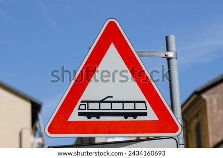 public transport tram, road signs, triangle, indicates medium passage such as light rail or tram, electrified on line with track, pay attention.