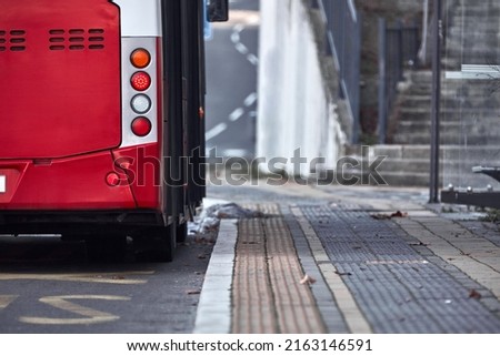 Public transportation bus in urban surroundings.