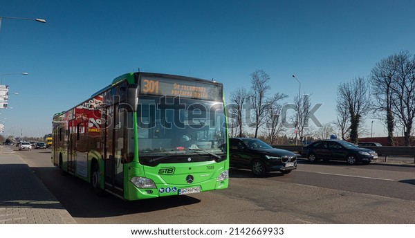 Public\
transportation service Mercedes bus driving at the entrance in\
Bucharest, on DN1 road. Romania,\
2022.