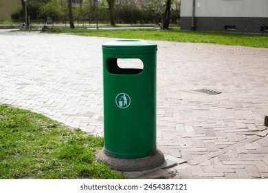 Public trash can on a city street filled with garbage