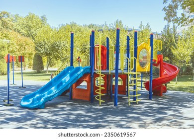 Public urban children's playground eco-friendly complex made of recycled plastic with greenery around. - Powered by Shutterstock