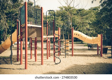Public's playground in city. Colorful playground on yard in the park. Park with set of modern kids playground background. children Stairs Slides equipment. Blur playground in park abstract background.