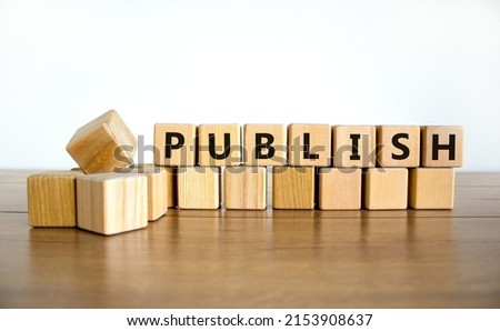 Publish symbol. The concept word Publish on wooden cubes. Beautiful wooden table, white background, copy space. Business publish and publishing concept.