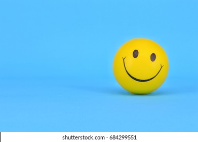 PUCHONG, SELANGOR, 25 JULY, 2017: Image Of A Yellow Ball With Smiley Face (smiley).On Blue Background.