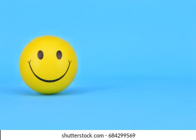 PUCHONG, SELANGOR, 25 JULY, 2017: Image Of A Yellow Ball With Smiley Face (smiley).On Blue Background.