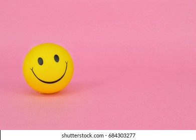 PUCHONG, SELANGOR, 25 JULY, 2017: Image Of A Yellow Ball With Smiley Face (smiley).On Pink Background.