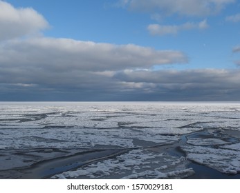 Pucka Bay/Baltic Sea in winter - view with the frozen sea and floes in a sunny and cloudy day. Poland, Pomerania - Shutterstock ID 1570029181