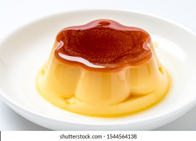 Pudding on plate on white background