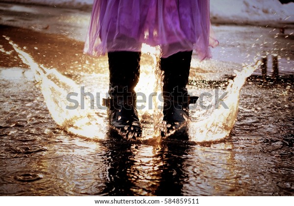 Puddle Fun Young Girls Feet Stomping Stock Photo Edit Now 584859511