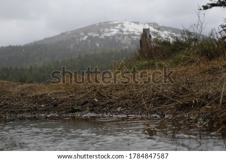 a puddle and a view of mount Spokane 