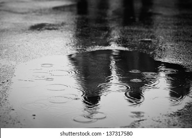 Puddle of water in rain - selective focus - Powered by Shutterstock