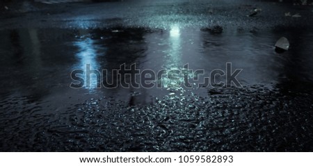Puddle of Water in Rainy Day.