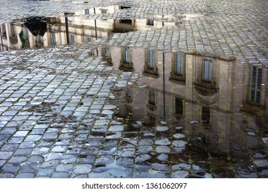 puddles in a cobbled street of Rome Italy, near "Piazza Navona" , reflecting fronts of historic baroque houses - Powered by Shutterstock - Get 15% off with code: PIKWIZARD15