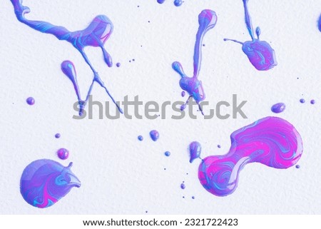 The puddles of a pink, lilac and blue mixed drops oil paint spill. Watercolor colorful drop splash. Splatter of ink drops in mixed color on white paper background. Sample of cosmetics. 