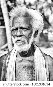 PUDUCHERRY, INDIA - DECEMBER Circa, 2018. Unidentified Portrait Close-up Of Old Face Indian Man Looking At The Camera,very Serious. Black And White Image