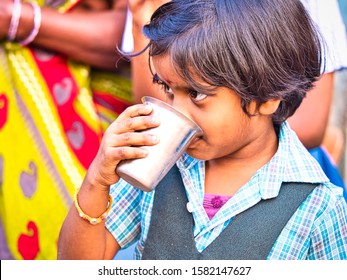 PUDUCHERRY, INDIA - DECEMBER Circa, 2018. Homeless And Poor Child Drinking Milk In The Streets. Representing The Situation Of Children In India, Who Doesn't Have Access To Home,nutrition Or Education.