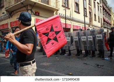 Puebla, Mexico - April 20, 2020: People From The Organization October 28 Of Latin American Mexican Nationality Demonstrated In The Streets Of Puebla In The Middle Of The Covid-19 Coronavirus Contingen