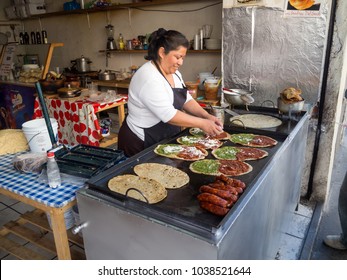 Puebla, Mexico, South America - January 2018: [Woman Cooking Memelas, Tacos, Quesadillas, Mexican Street Food]