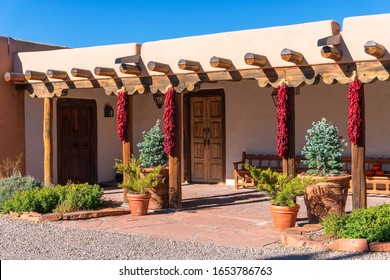 Pueblo Style Adobe Architecture Home  With Ristras In Santa Fe, New Mexico