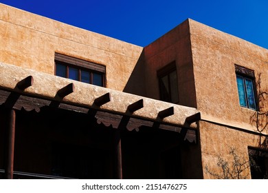 A Pueblo Style Building With Windows