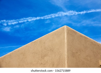 A Pueblo Style House Corner On A Blue Sky