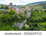 Puentedey in Burgos province Spain on July 11, 2024.  It is a rock arch that the river Nela has been carving for millions of years on which a town has been built. Panorama from the viewpoint.