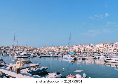 Puerto Banus, Marbella 25 de febrero de 2022, View of Puerto Banus marina with boats and white houses in Marbella town at sunrise, Andalusia, Spain