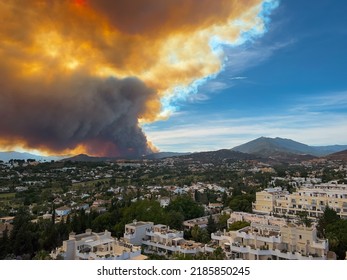 Puerto Banus, Spain, June, 8, 2022: Huge Forest And Bush Fire In Marbella Spain With A Huge Smoke Cloud Hanging Over The Area