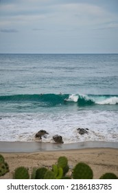 Puerto Escondido, Mexico - August 9, 2021: People Surfing At Zicatela Beach In Oaxaca, Puerto Escondido