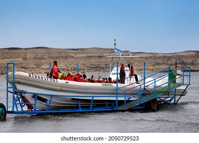 Puerto Piramides, Argentina - July 24, 2021: Tourists Are Towed In Their Rib Boat Towards The Water To Do A Whale Watching Tour In Valdez Peninsula