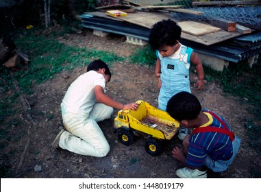 Puerto Rico, Ceiba, Young Puerto Rican Boys Playing With A Toy Truck On Three Kings Day, January 6, 1992