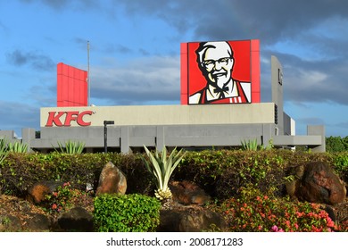 Puerto Rico, USA, dated 12-07-2021. Picture of the facade of a KFC restaurant with the famous colonel Sanders face best known for founding fast food chicken restaurant chain Kentucky Fried Chicken.