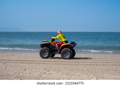 Puerto Vallarta Mexico Dec 2 2021: Beach Safe Guard Drive An ATV Along The Sandy Shoreline. Water Safety Concept.