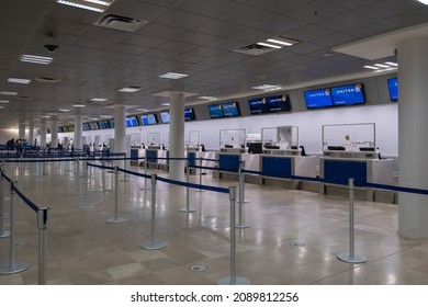 Puerto Vallarta Mexico Dec 3 2021: Line Of Empty Check In Desks At The Airport. Empty Airport, Severe Weather, Advisory, Alert, Flight Cancellation, Airport Shut Down Concept.