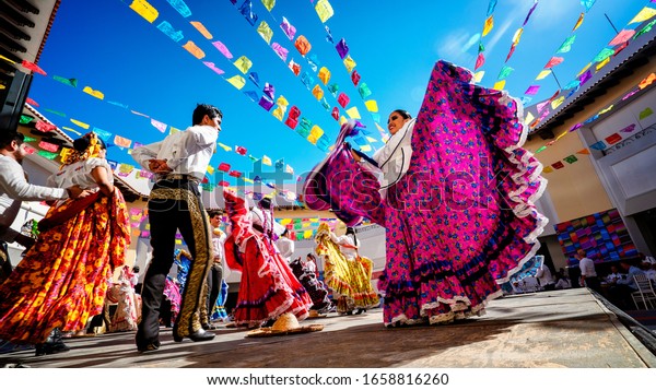 Puerto Vallarta, Mexico - January 28th 2020 -\
Photo of folklore dancers dancing in a beautiful traditional dress\
representing mexican\
culture.