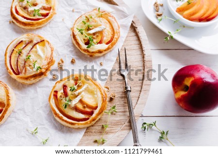 Similar – Puff pastry biscuits with nectarines, camembert and thyme