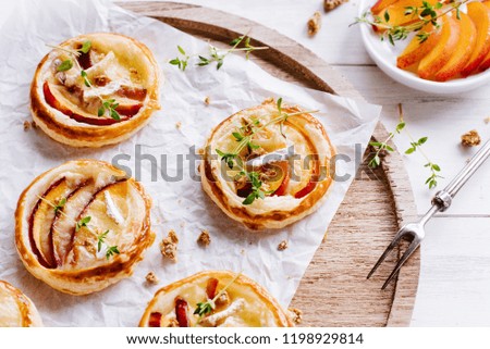 Similar – Puff pastry biscuits with nectarines, camembert and thyme