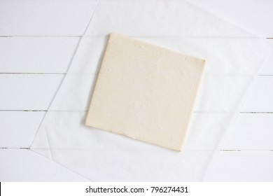 Puff Pastry Frozen Sheet White Parchment Background.