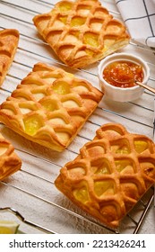 Puff Pastry Mini Pies With With Pear And Lime Jam Filling On A Roasting Rack With Fresh With Pear, Horizontal View From Above, Flatlay