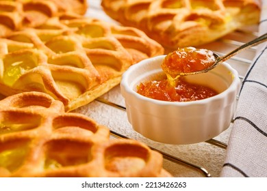 Puff Pastry Mini Pies With With Pear And Lime Jam Filling On A Roasting Rack With Fresh With Pear, Horizontal View From Above, Flatlay