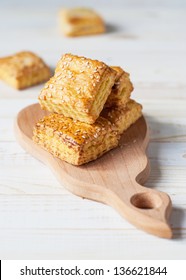 Puff Square Pastry With Sesame On Wooden Table