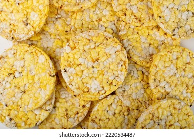 Puffed Corn Cake Texture Background. Corn Diet Bread With Fragrant Herbs And Spices, Waffle With Corns, Rice, Cereal Snack, Yellow Crackers, Diet Galettes On White Background